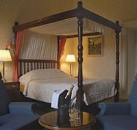 A bedroom in the Cally Palace Hotel